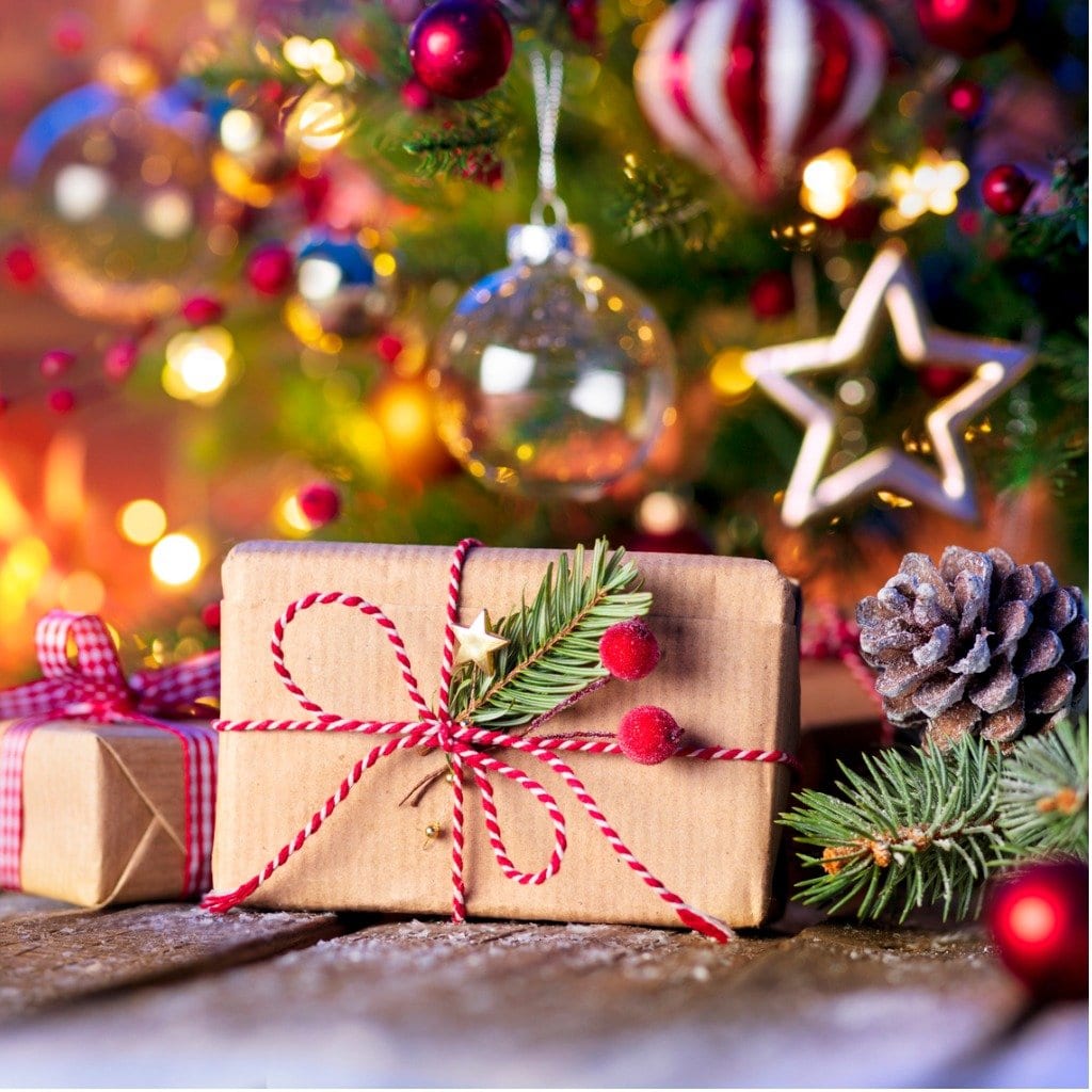 christmas-home-room-gift-box-below-tree-with-lights-and-fireplace-picture-id1182939977 (1)
