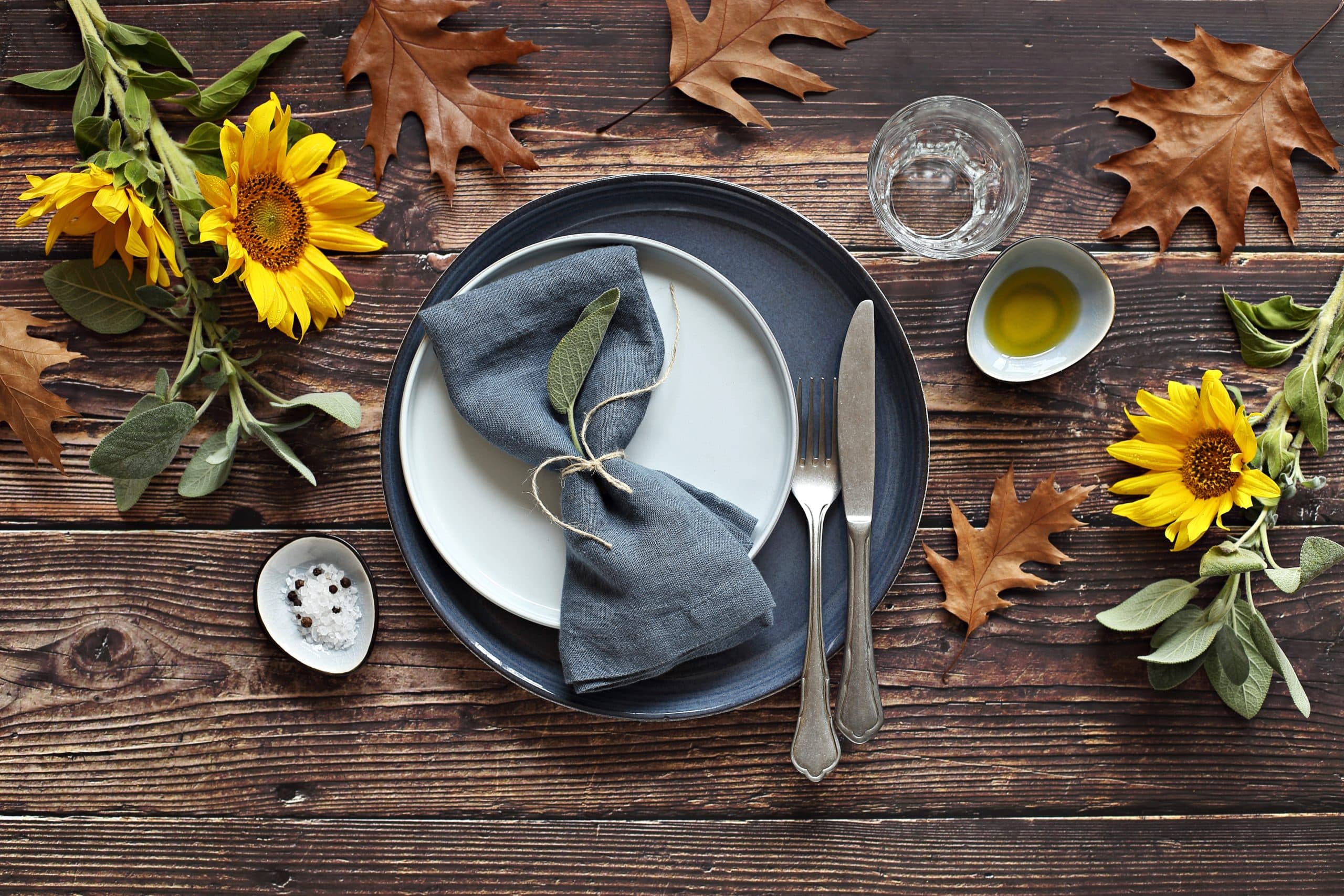 Table scape for Thanksgiving day dinner. Table decoration for festive autumn family party. Rustic style, selective focus