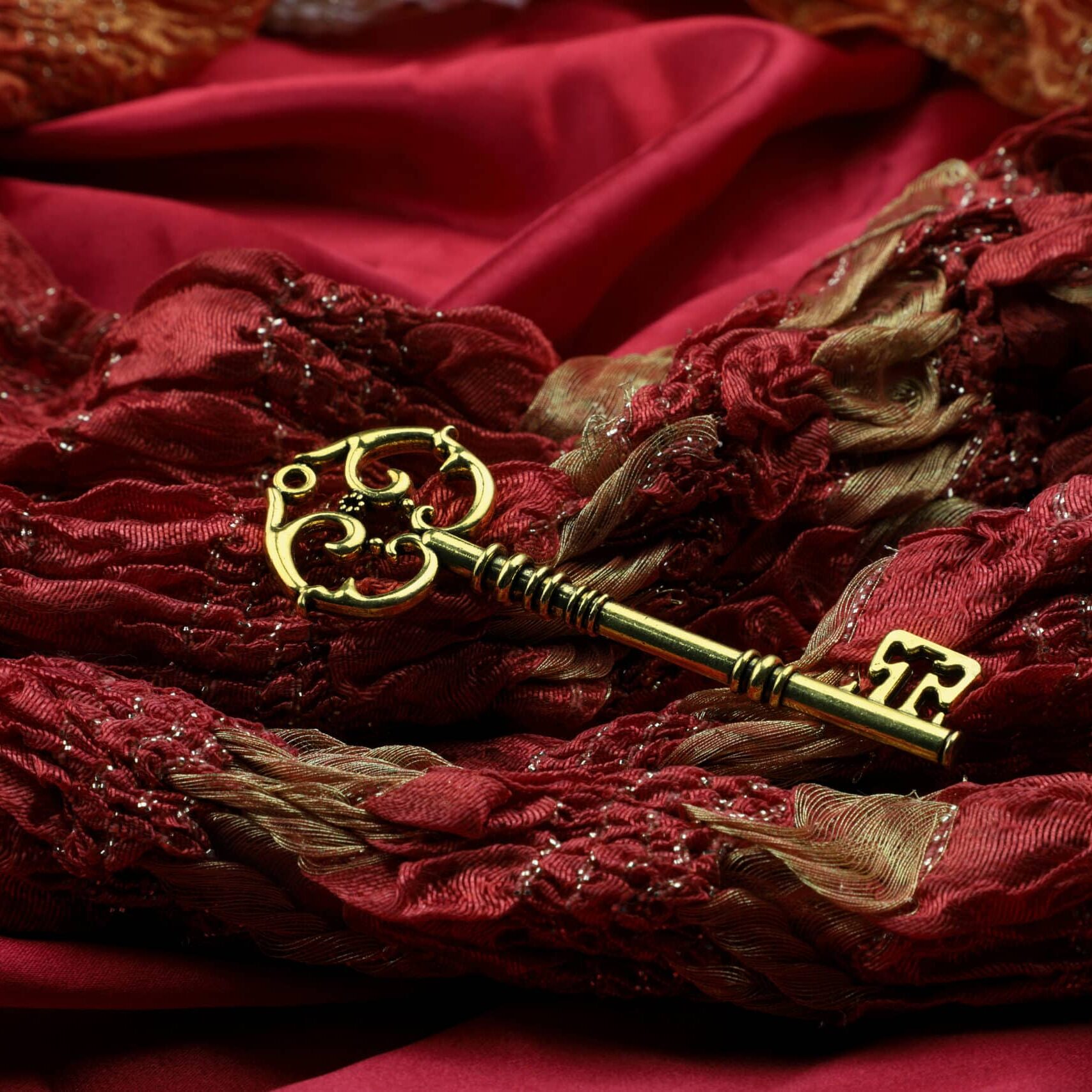 Golden Vintage Luxury Key on Red Royal Fabric
