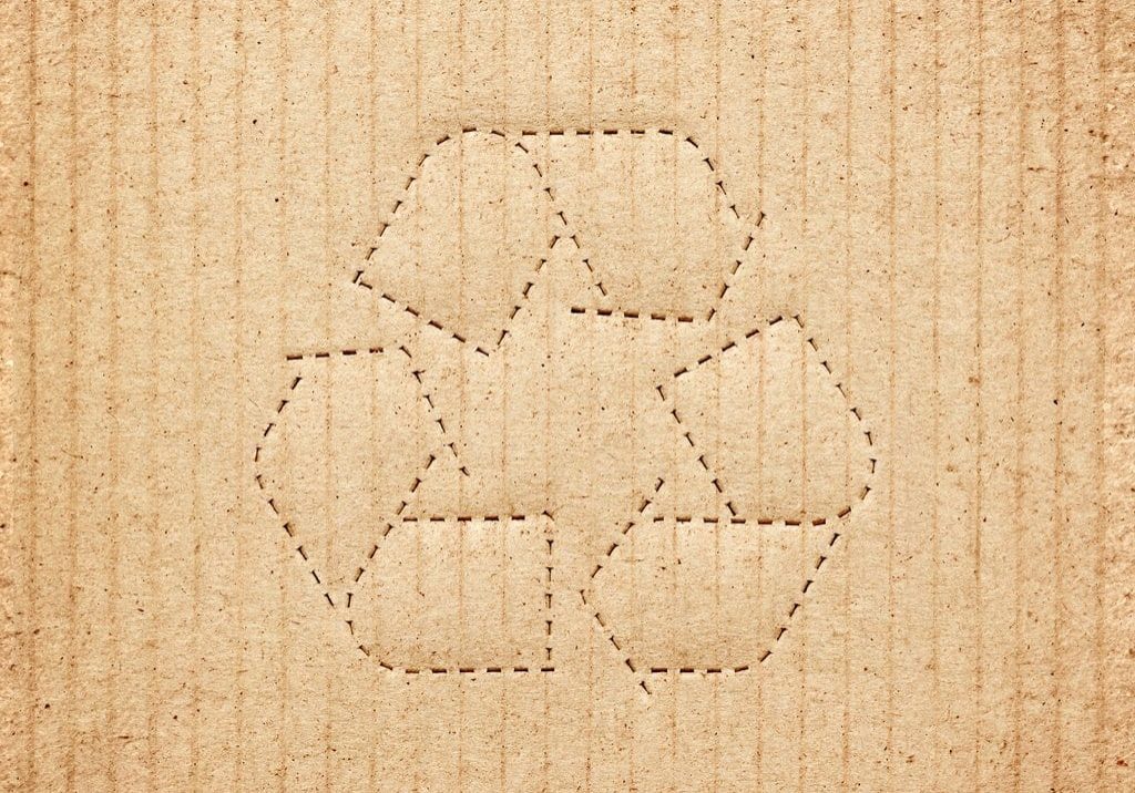 Cardboard box background with recycle symbol